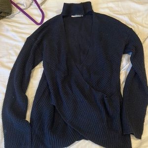 Navy blue sweater with choker neck and opening the front. Cute with tanktop